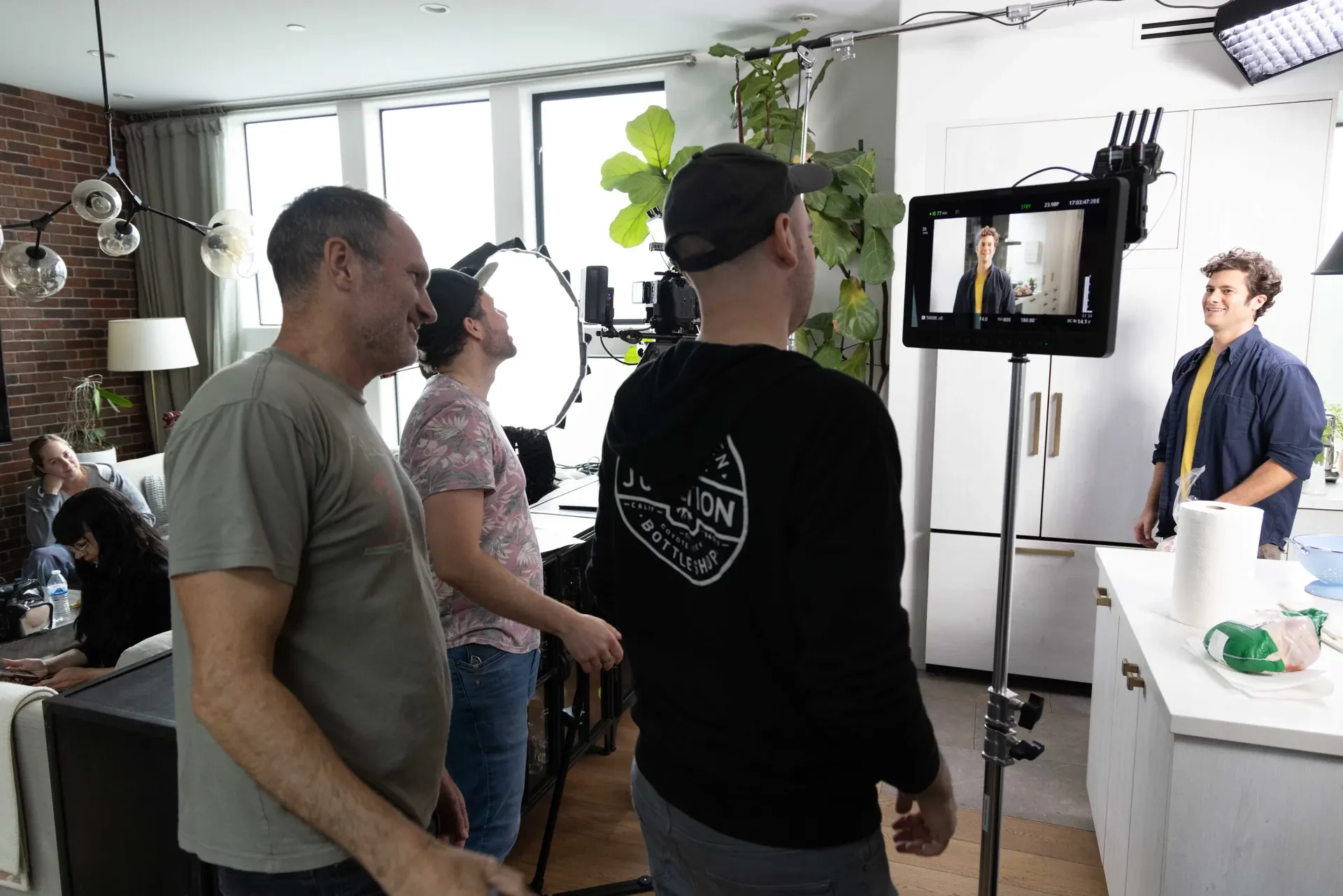 The Nomadic Creations crew lining up a shot in a bright studio